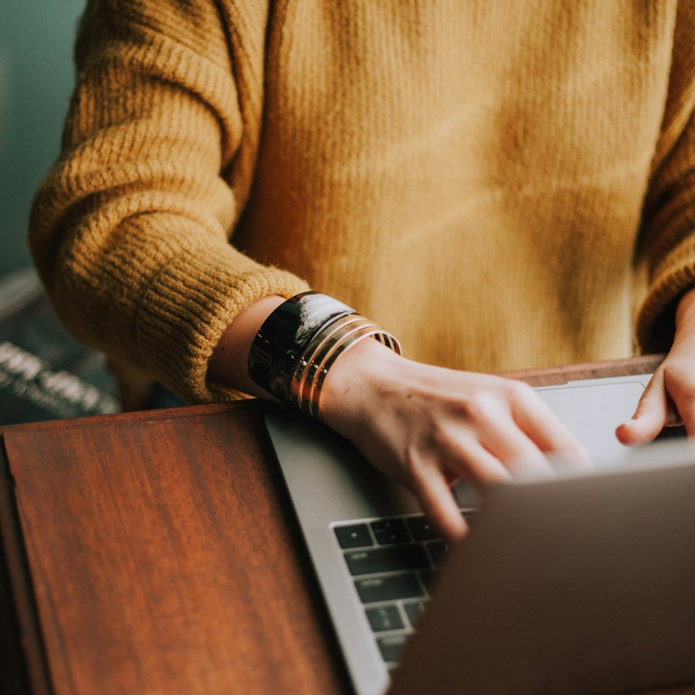 Person using a laptop at a table
